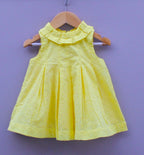 Yellow Sleeveless Cotton Frock with chikan Eyelet Design