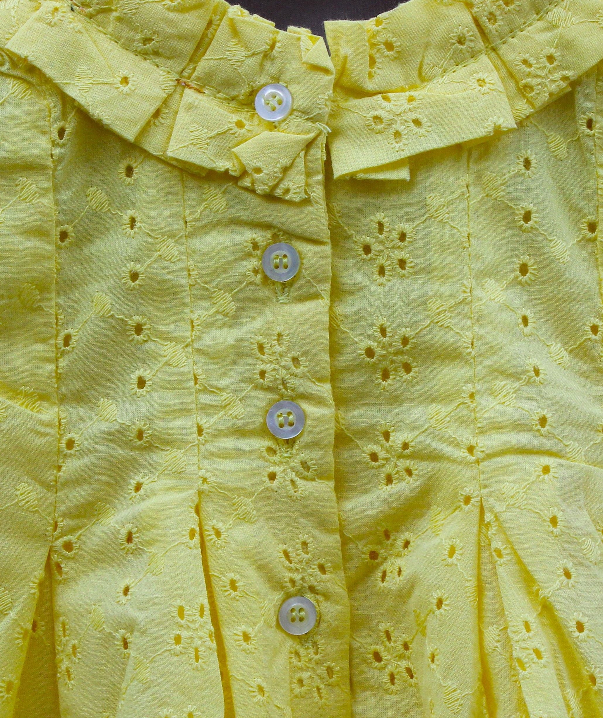 Yellow Sleeveless Cotton Frock with chikan Eyelet Design